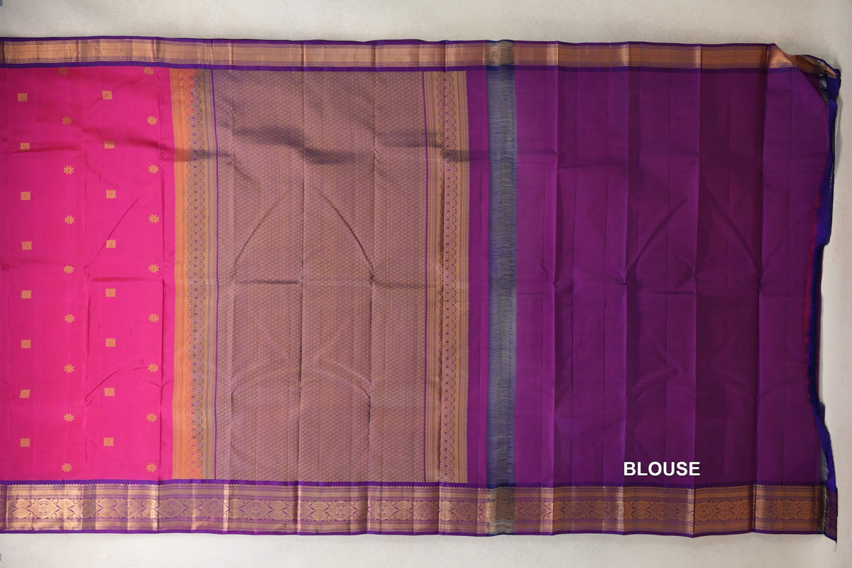Spread-out light weight Kanchipuram silk saree with a rani pink body, gold motifs and ornate borders, a lattice-patterned pallu, and a magenta purple blouse piece.