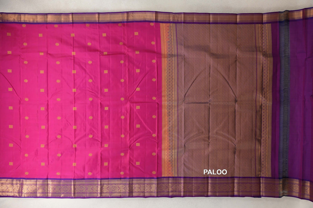 Rani pink light weight Kanchipuram silk saree spread open, with small gold motifs, magenta purple borders and a lattice-patterned pallu.