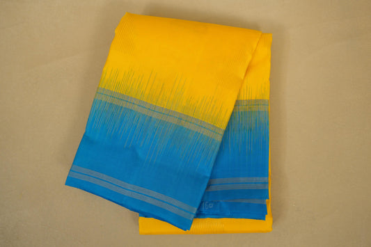 folded Bright Yellow with Sky Blue Borders Light Weight Kanchipuram Silk Saree