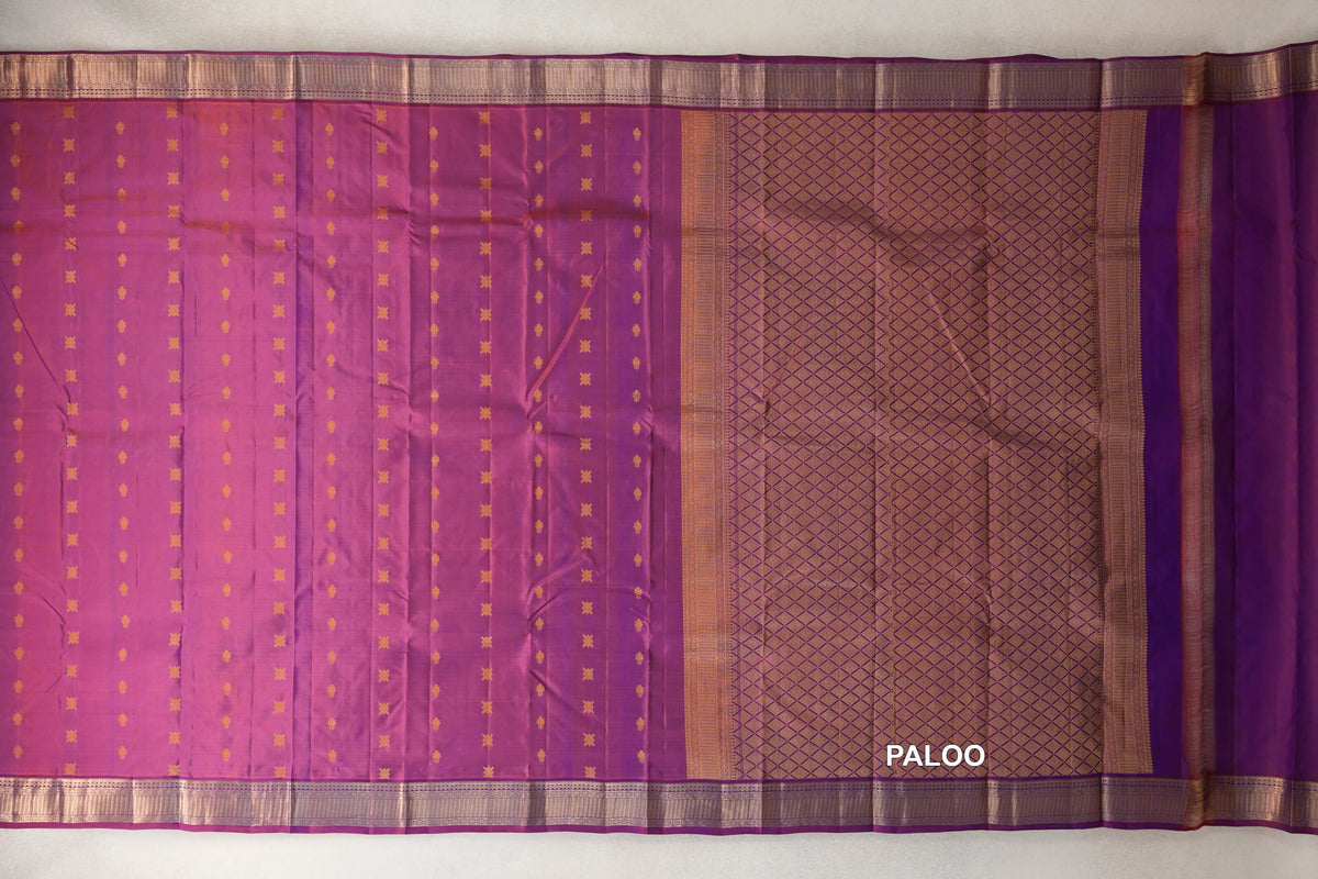 Blue and red Light Weight Kanchipuram silk saree spread flat, with small gold motifs, patterned borders and a diamond-grid pallu.