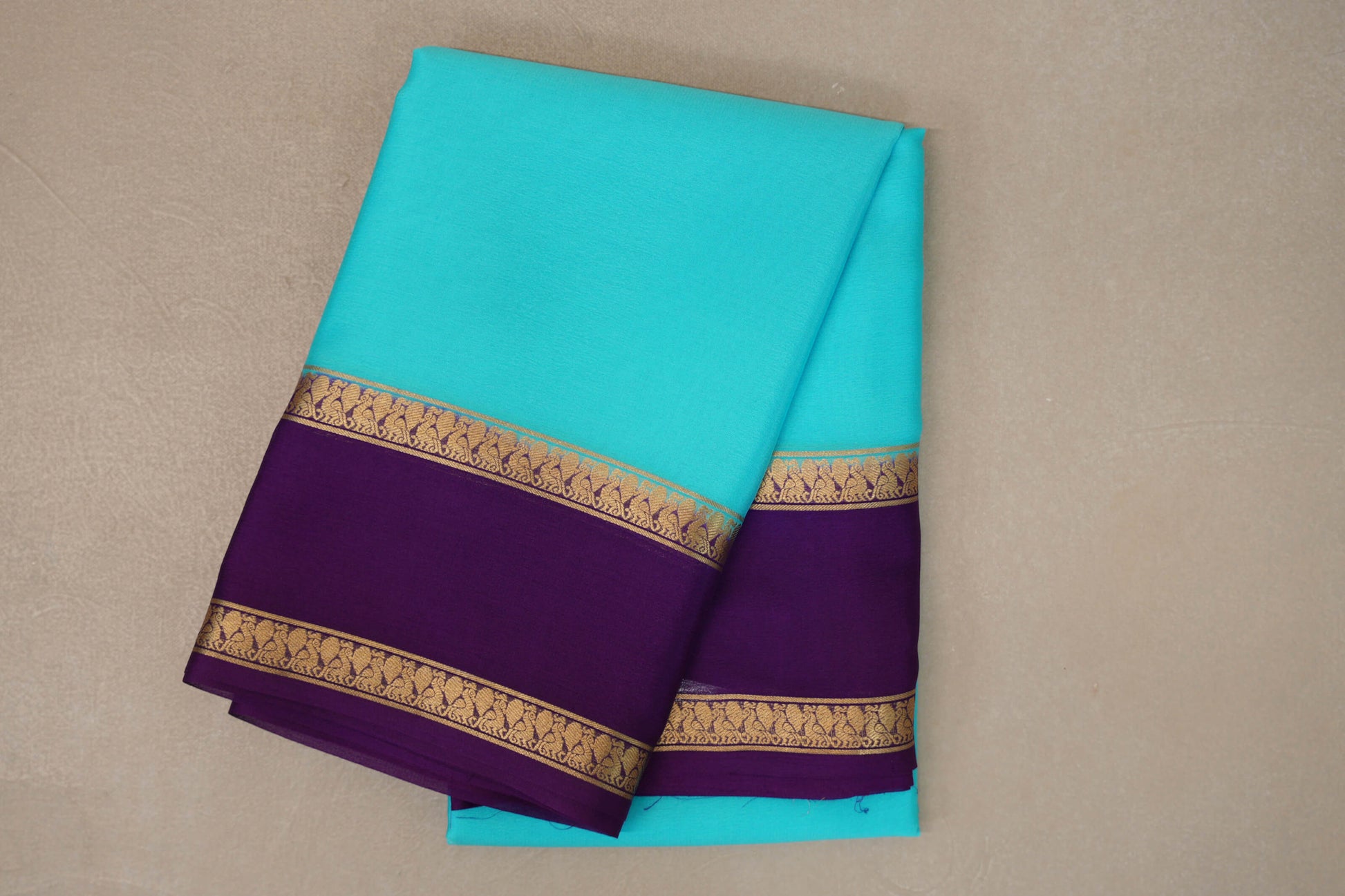 folded Aqua Blue Mysore Silk Saree