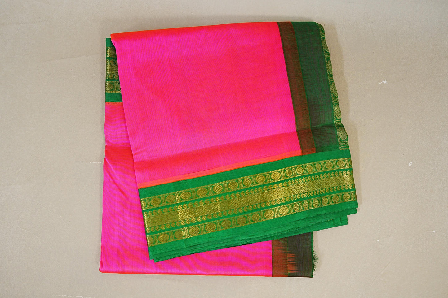 folded Rani Pink with Parrot Green Borders Silk Cotton Saree