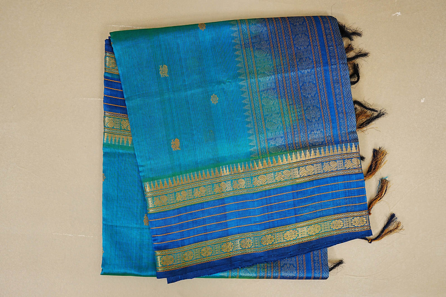 folded Peacock Blue with Deep Blue Borders Silk Cotton Saree 
