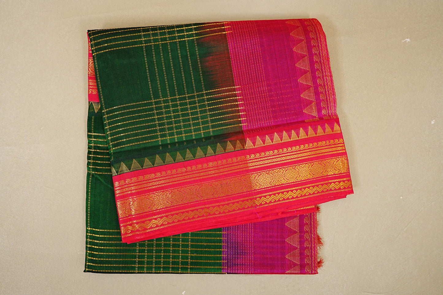 folded Bottle Green with Rani Pink Borders Silk Cotton Saree