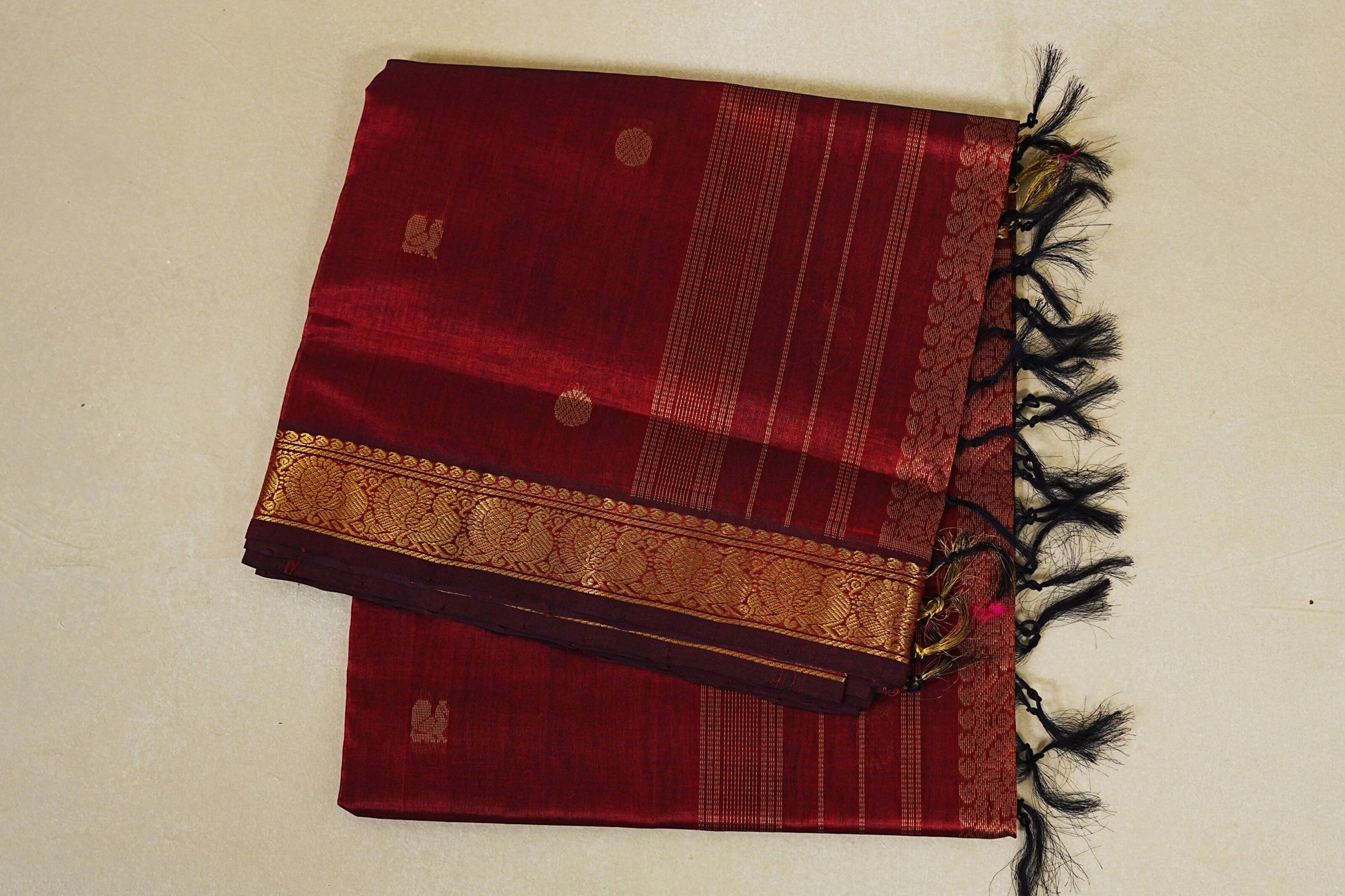 folded Reddish maroon vegan silk cotton saree 