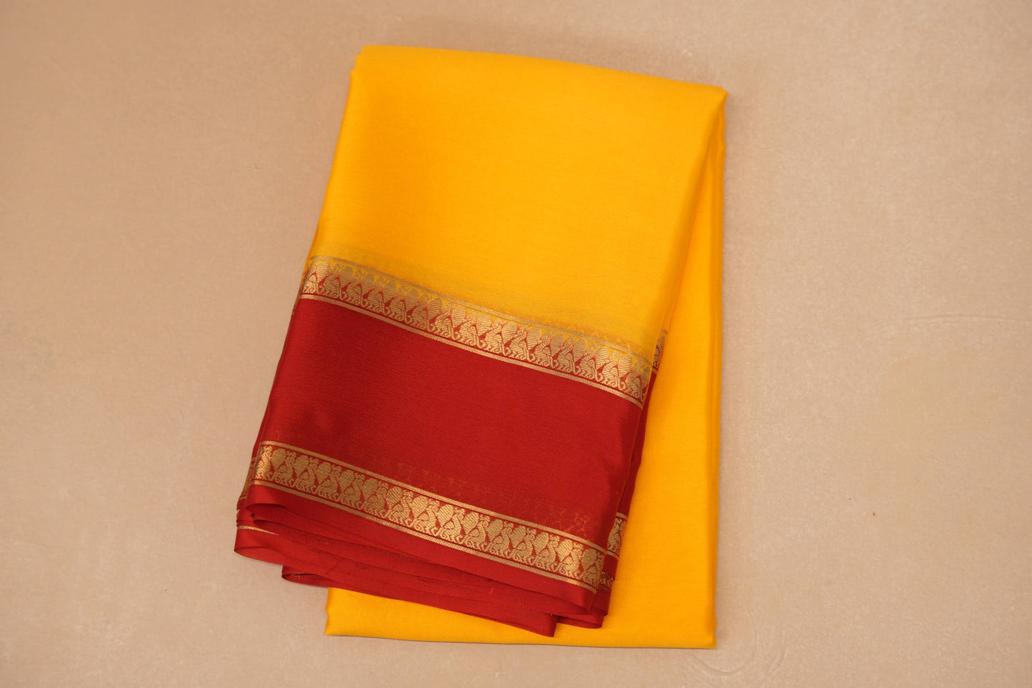 folded Mango Yellow with Bright Red Borders Mysore Silk Saree