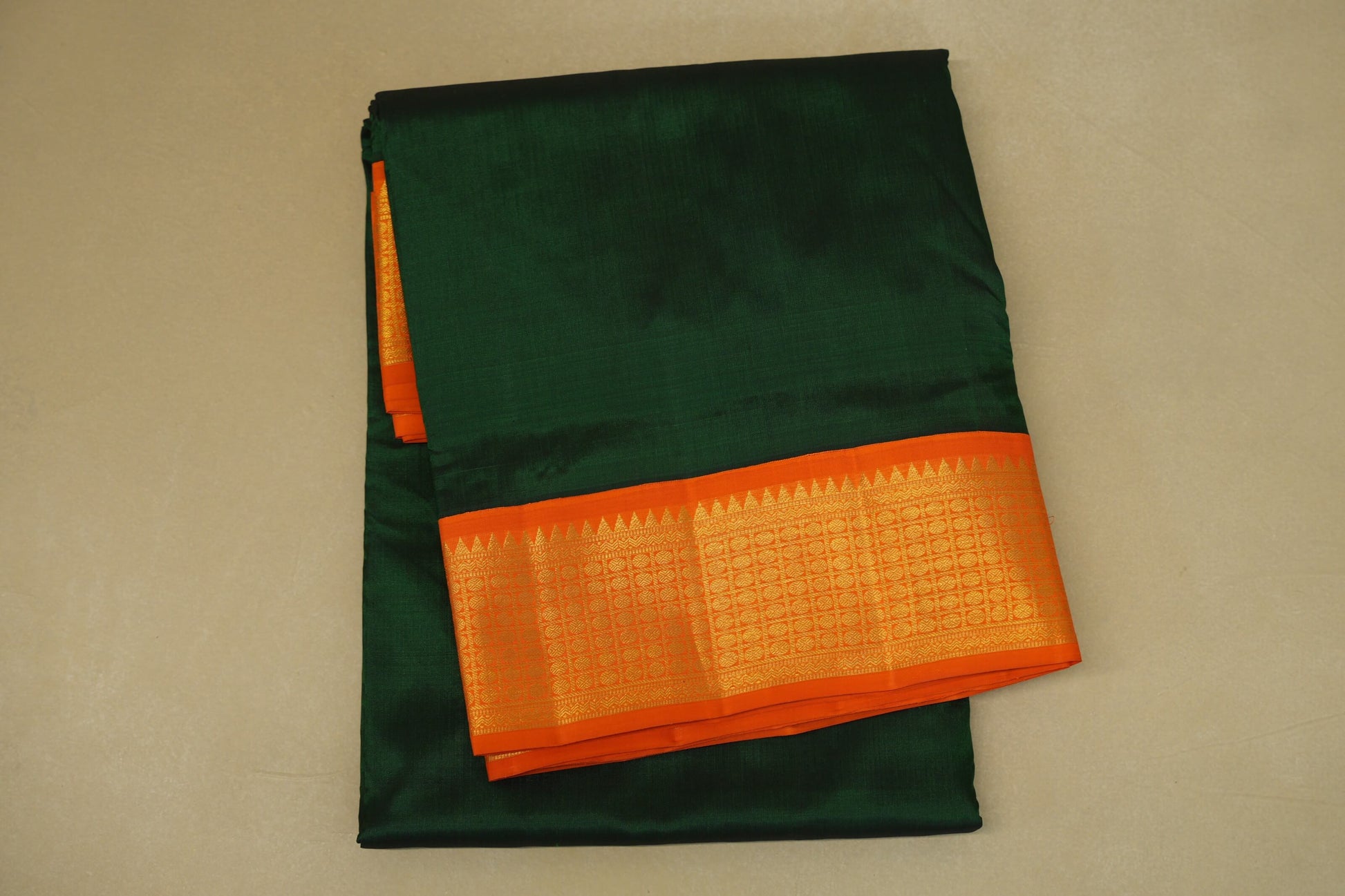 folded Deep Bottle Green with Bright Orange Borders Ten yards silk saree 