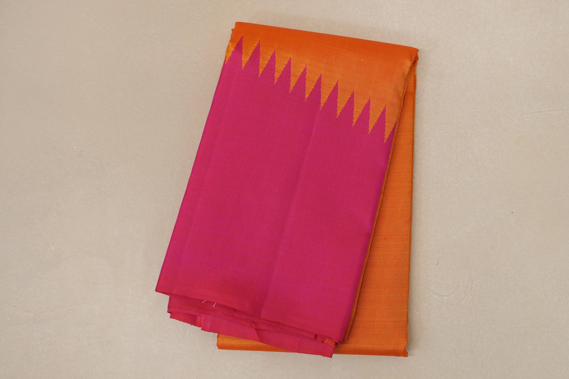 folded Reddish Orange with Bright Pink Borders Vintage Kanjivaram Silk Saree