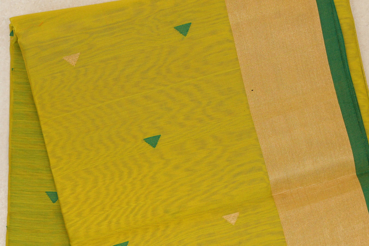Folded bright lemon yellow Maheshwari silk cotton saree with small green and gold triangles, a broad gold border and leaf green edge.